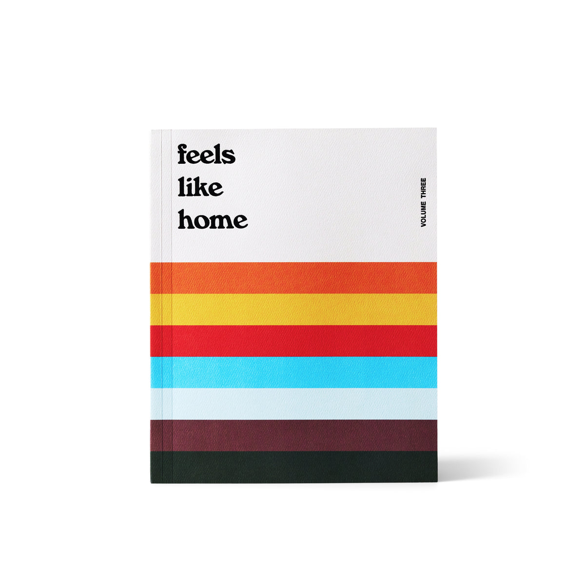 Front cover of Feels Like Home Volume III with the wordmark above horizontal stripes in orange, yellow, red, blue, and maroon